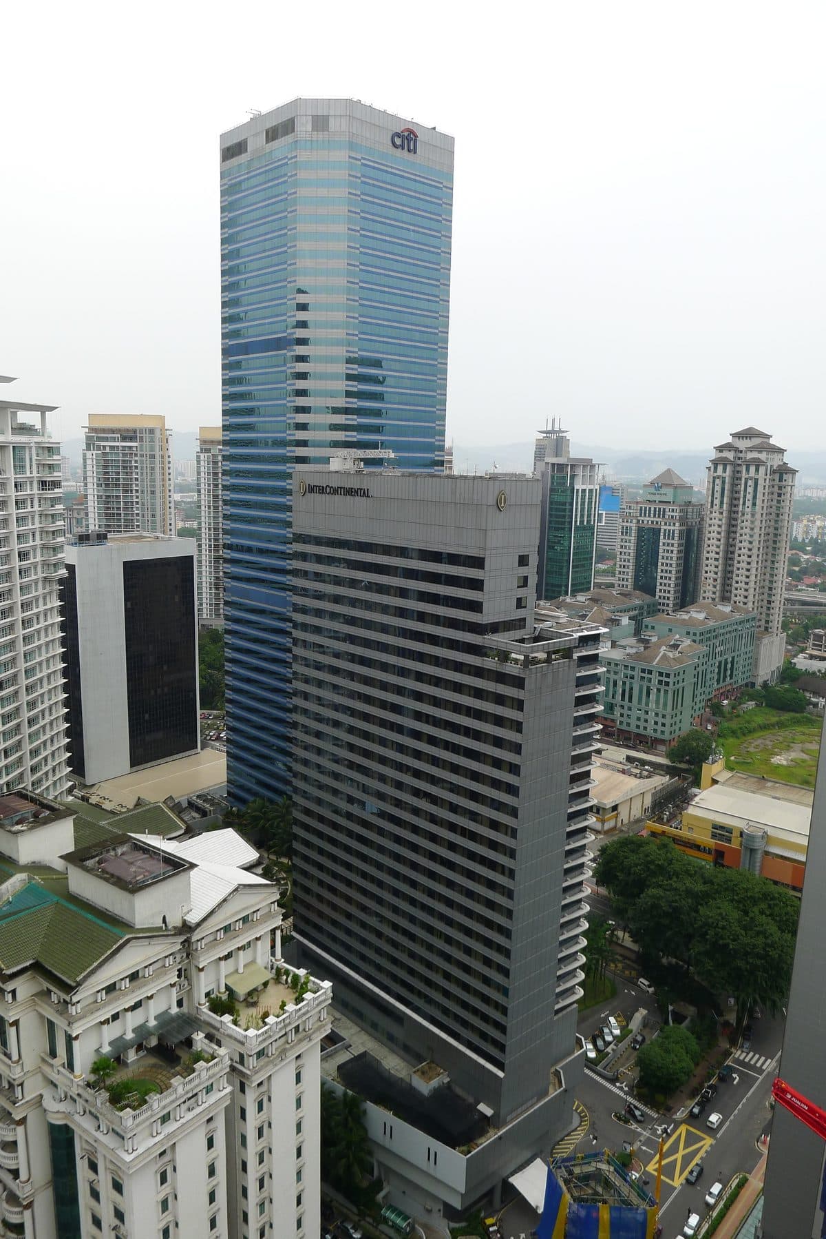 The InterContinental Kuala Lumpur tower on Jalan Ampang, its name at the top, with the taller Menara Citibank behind it